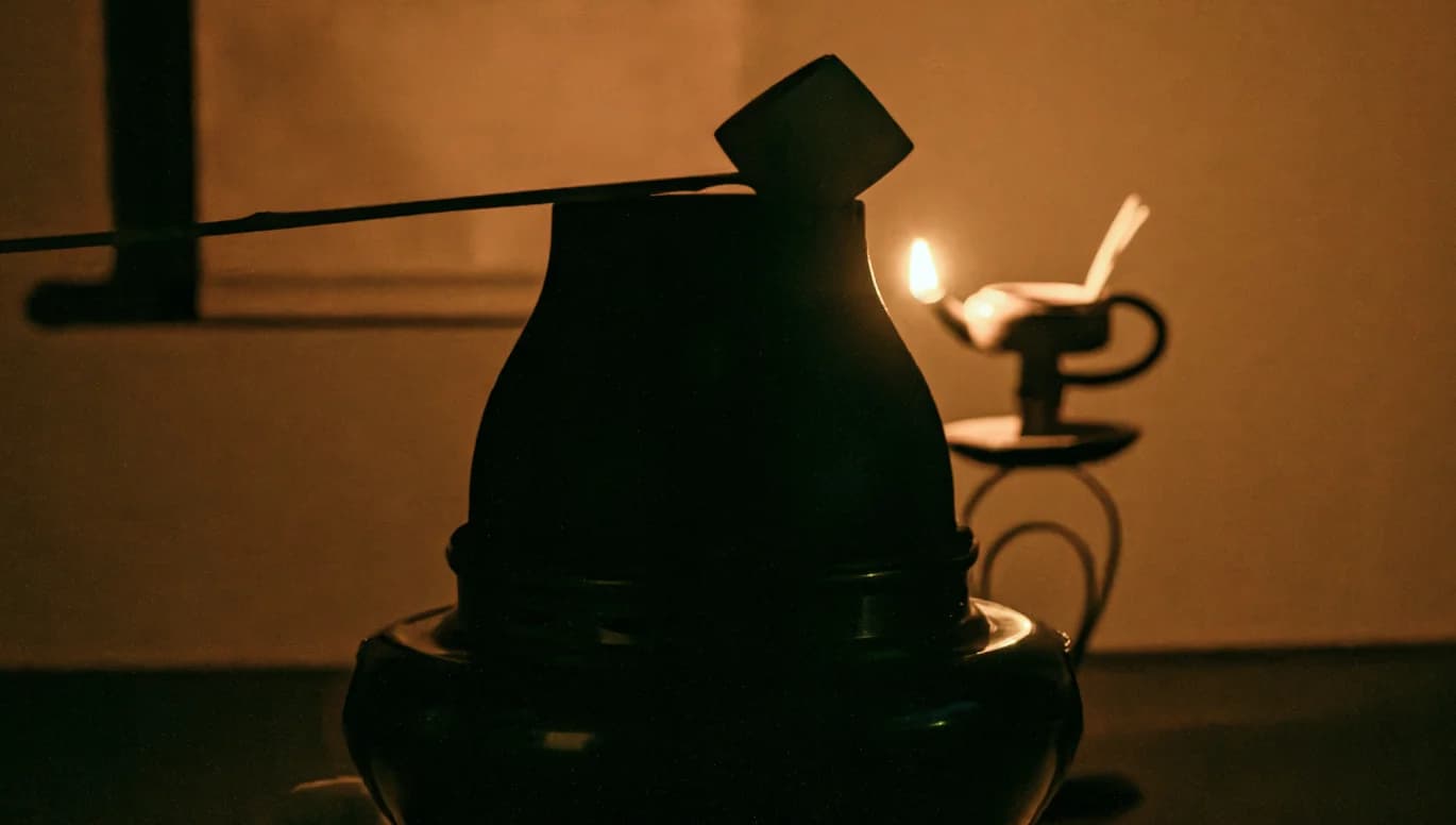 Silhouette of a tea ladle on a kettle